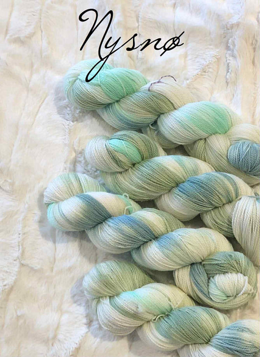 Kvitlammets Luksus Merino. Nysnø. 100 g: 600 m.